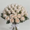 Bouquet of cream roses tied with a white ribbon
