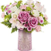 Pink and white flower arrangement in a textured vase
