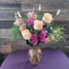 Peach roses and purple daisies in a soft, airy mix&mdash;fresh, light, and