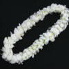 White flower lei on a black background