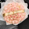 Pale pink roses gathered into a generous, rounded birthday bouquet-soft, romantic, and