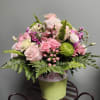 The striking green, and white tin has a contrasting pink floral cutout.