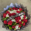 Bouquet of red roses with baby's breath and a Feliz Dia de la Novia ribbon