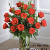 Bouquet of red roses in a clear glass vase