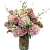 A sophisticated and graceful arrangement designed with soft, romantic tones. This elegant