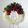 A full ring of soft white chrysanthemums and blooms creates a quietly