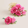 A vibrant and coordinated floral set featuring a hot pink spray rose