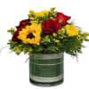 Bouquet of red roses and yellow sunflowers in a glass vase
