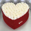 Heart-shaped box filled with white roses