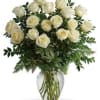 This timeless arrangement is filled with 18 white roses in  a