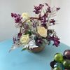 Dark purples, partnered with cream and white blooms. This exotic twist play