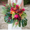 This gorgeous selection of tropical blooms will delight the senses and fill