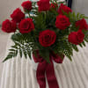A classic and elegant arrangement of a dozen premium red roses in