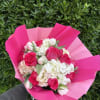 Vivid pink roses sit at the heart of this Mother's Day bouquet