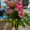 Large proteas flowers with roses and tulips