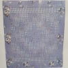 The soft, patchwork quilt in soothing blue, white and lavender tones offers