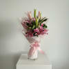 Soft pink lilies open like gentle stars-this pink and white lily bouquet