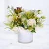 Wildlight is a modern white and green floral arrangement designed with premium
