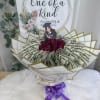 A luxurious bouquet made with a dozen real roses and real $1
