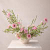 A delicate, movement-rich arrangement inspired by the softness of a blooming spring