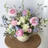 Celebrate the beauty of spring with our Petals of Spring floral arrangement
