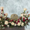 White and red rose arrangement with a memorial stone centerpiece