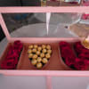 Pink gift box with red roses and Ferrero Rocher chocolates