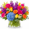 A bold and cheerful summer arrangement bursting with vibrant spray roses, fluffy