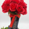 ​A striking, high-contrast arrangement designed to command attention. Vibrant, velvety red roses