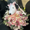 Pink rose bouquet with lilies and a Snoopy plush topper