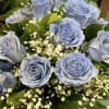 Bouquet of pale blue roses with white baby's breath