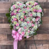 SOLID HEART FILLED WITH AN ASSORTMENT OF PASTEL FLOWERS. WILL INCLUDE HYDRANGEAS