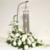 White floral arrangement with hanging wind chimes