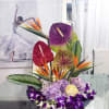 This arrangement feels like a collision between a rainforest and a luxury