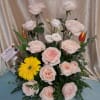 Pale blush garden roses take center stage in this pink garden rose