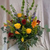 A lively twelve-rose arrangement that feels like a celebration in bloom -