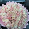 A lavish dome of 100 roses in pale pink and creamy white