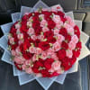 A lush, hand-tied floral bouquet built around classic roses and lilies-BUCHONES is
