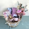 Gift a wonderful blush basket of treats and joyful flowers.
The blush and