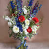 Red, White and Blues in a pretty and symbolic hand tied bouquet