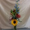 A bright sunflower anchored at the base sets the tone for this