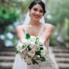 Bride holding a white and blush wedding bouquet