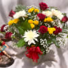 Bouquet of red and yellow roses with white chrysanthemums in a vase