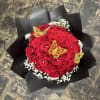 Red rose bouquet with white baby's breath and yellow butterfly decorations