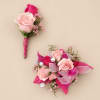 Soft blush and bright pink roses mingle with delicate white and purple