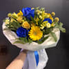 Golden Blue Harmony is a striking bouquet that captures attention with its