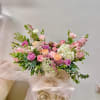 Made from fresh flowers, a corsage looks like a petite flower arrangement
