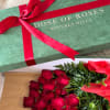 Box of red roses tied with a red ribbon