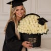 Cream-white roses arranged in a dense, luxurious dome create a timeless graduation