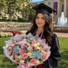 Soft pastel blooms arranged for a proud moment: this large hand-tied graduation